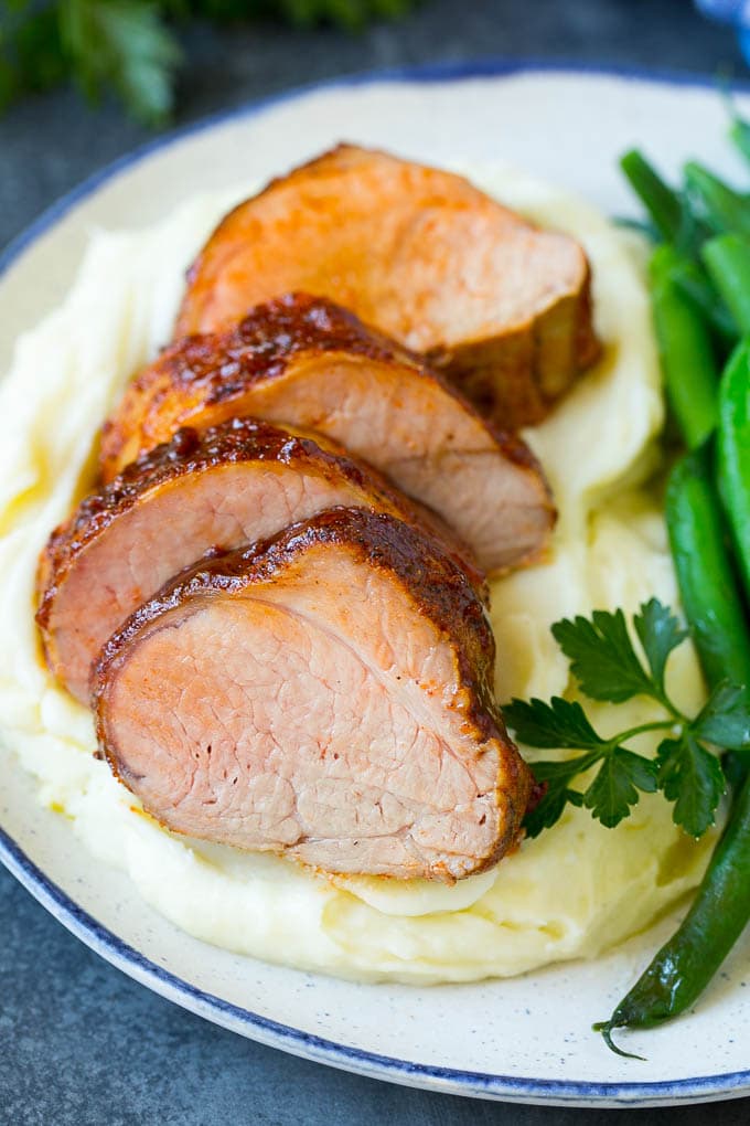 Smoked Pork Tenderloin Recipe | Smoked Pork Loin | BBQ Pork #pork #tenderloin #smoker #dinner #jonep Sliced smoked pork tenderloin served with mashed potatoes and vegetables.