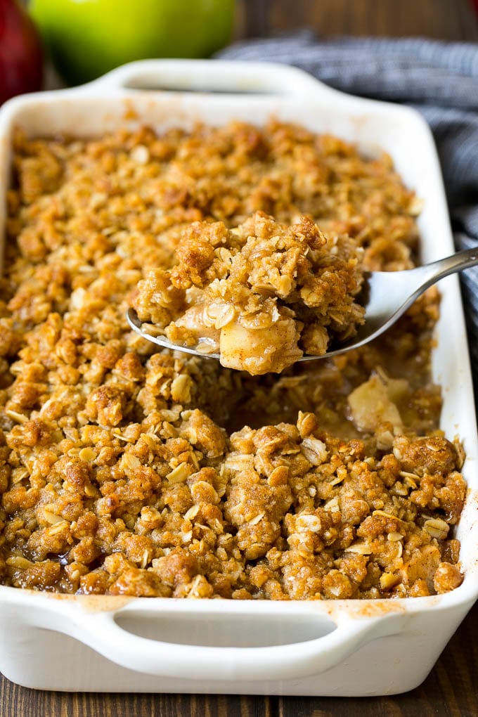 Apple Crisp Recipe | Apple Dessert #apples #dessert #baking #fall #jonep A spoon serving up a portion of apple crisp.