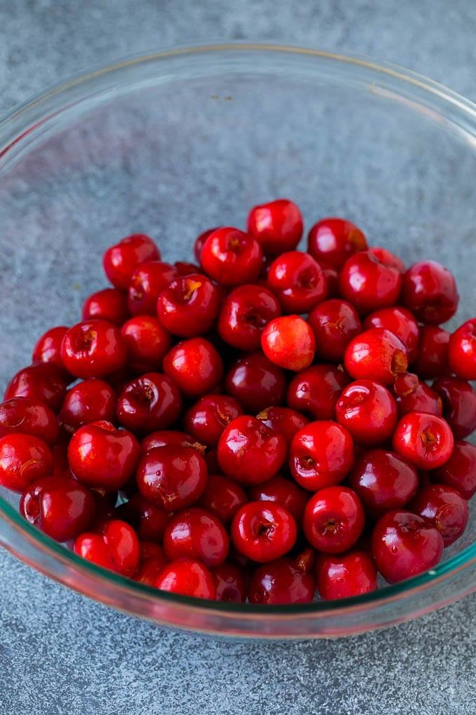 Cherry Pie Filling Recipe #pie #cherries #dessert #sweets #jonep #summer A bowl of pitted cherries.