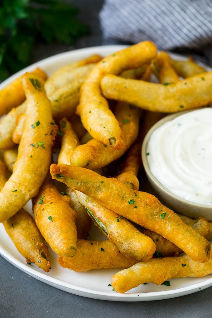 Fried Green Beans Recipe | Green Beans #greenbeans #appetizer #snack #jonep A plate of fried green beans served with ranch dip.