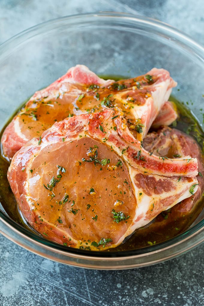 Grilled Pork Chops | Pork Chop Marinade #porkchops #grilling #pork #marinade #dinner #jonep Pork chops in a bowl of marinade.