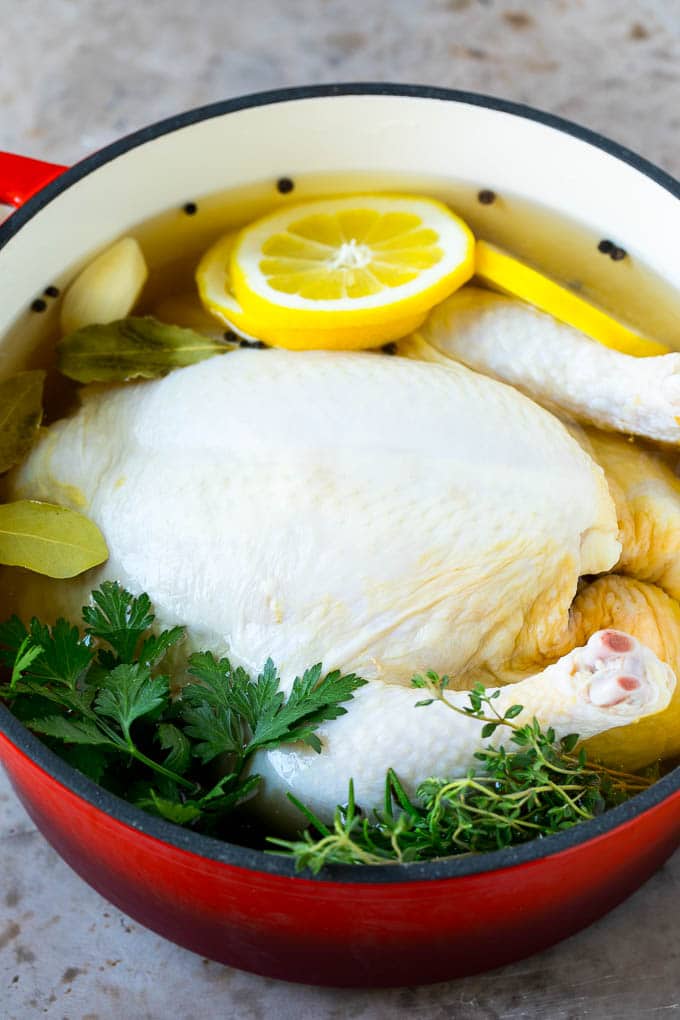 Rotisserie Chicken Recipe | Roasted Chicken #chicken #dinner #jonep #comfortfood A whole chicken in a pot of brine.