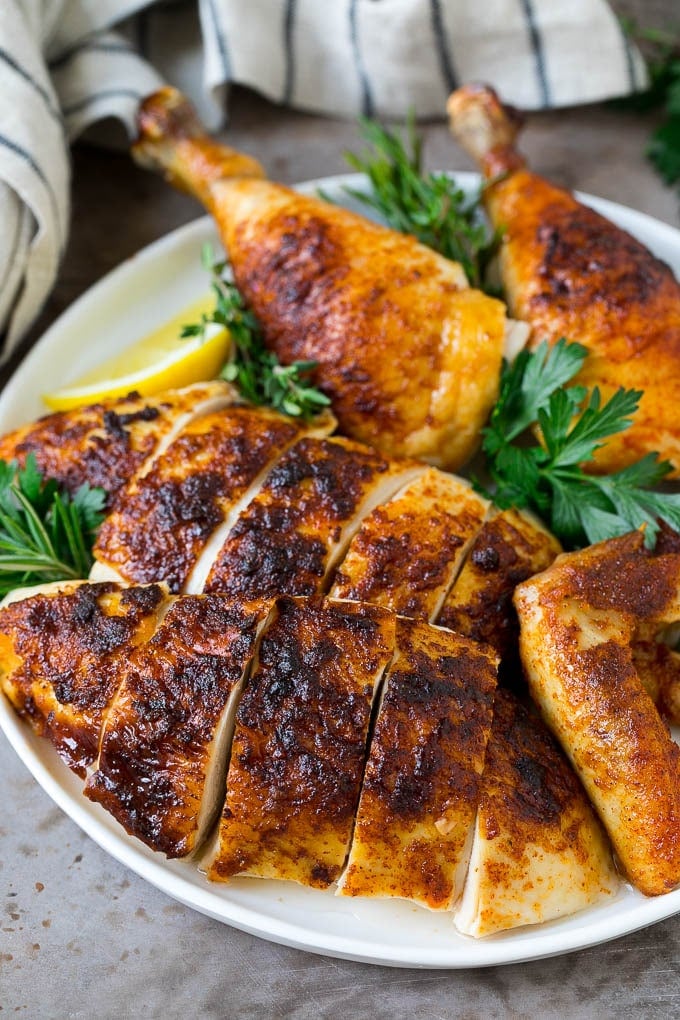 Rotisserie Chicken Recipe | Roasted Chicken #chicken #dinner #jonep #comfortfood Sliced roasted chicken on a serving plate.