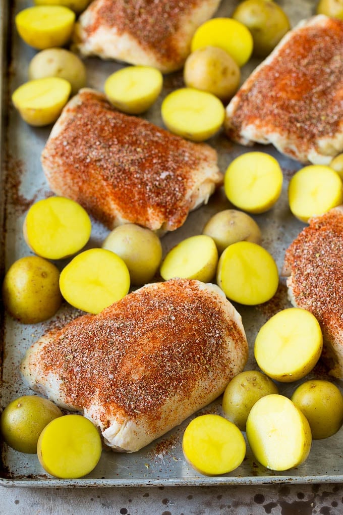 Thighs coated in spices with small Yukon golds.