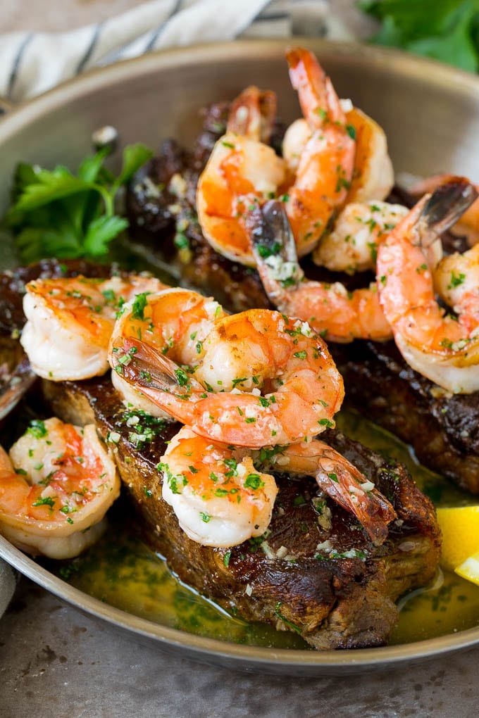 Surf and Turf Recipe | Seared Steak #steak #shrimp #keto #lowcarb #dinner #jonep Surf and turf with seared strip steaks topped with jumbo shrimp in garlic butter.