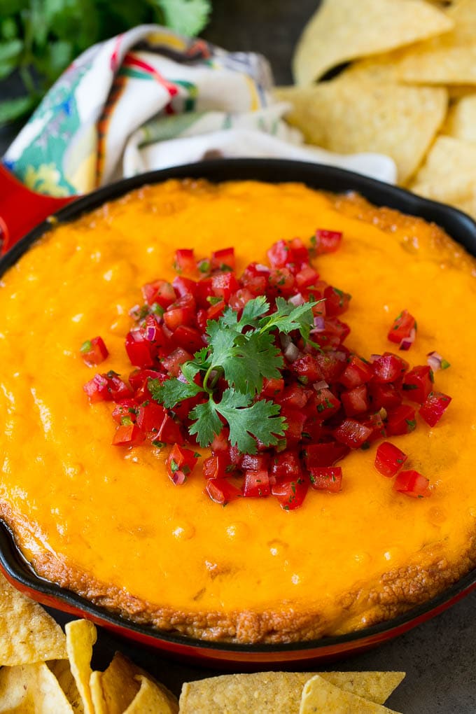 Bean Dip Recipe | Mexican Dip #dip #appetizer #mexicanfood #beans #cheese #jonep Cheesy Mexican bean dip topped with melted cheese and pico de gallo.