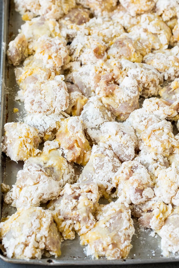 General Tso's Chicken Recipe #chicken #asianfood #dinner #jonep #copycatrecipe Chicken pieces coated in egg, flour and cornstarch.