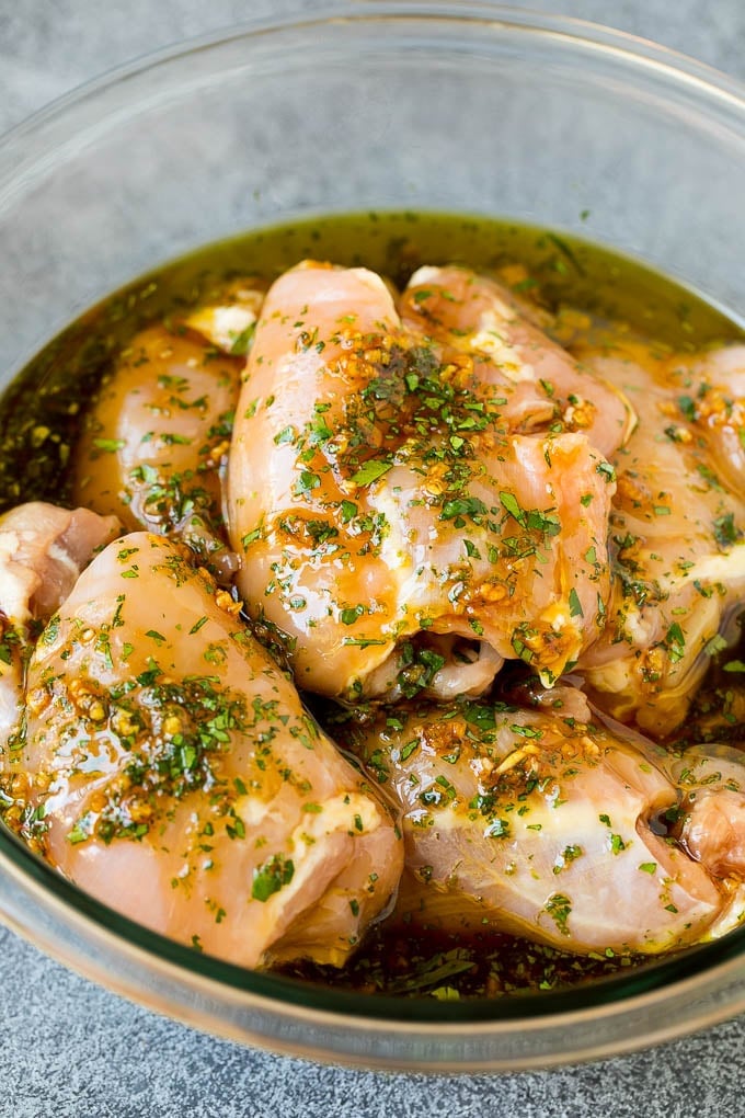 Poultry in a bowl of marinade.