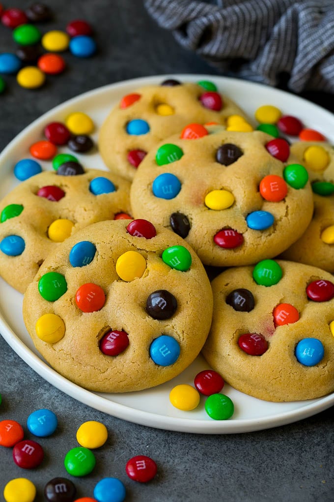 M&M Cookies Recipe #cookies #chocolate #baking #dessert #sweets #jonep A plate of M&M cookies, garnished with extra candy.