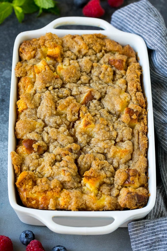 French Toast Casserole Recipe | French Toast Bake #frenchtoast #casserole #breakfast #brunch #jonep #bread A dish of french toast casserole topped with brown sugar streusel.