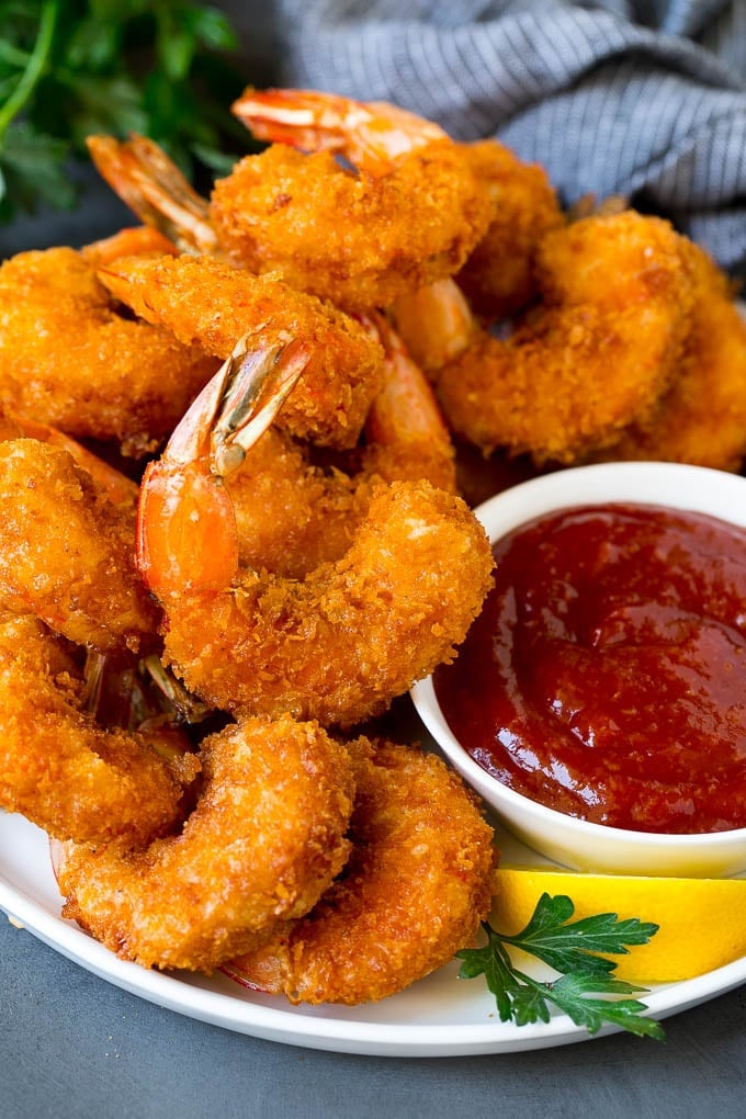 Fried Shrimp Recipe #shrimp #seafood #dinner #appetizer #jonep A plate of fried shrimp served with cocktail sauce.