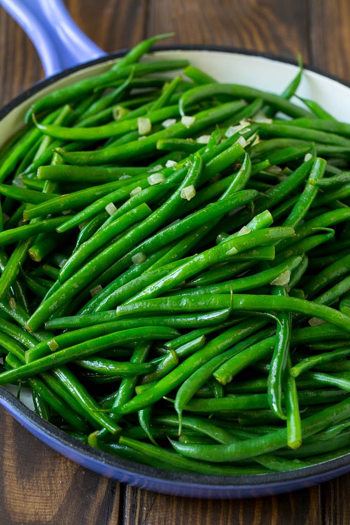 Green Beans with Bacon Recipe | Bacon Green Beans #bacon #greenbeans #sidedish #thanksgiving #veggies #dinner #jonep Cooked green beans tossed with diced onion.