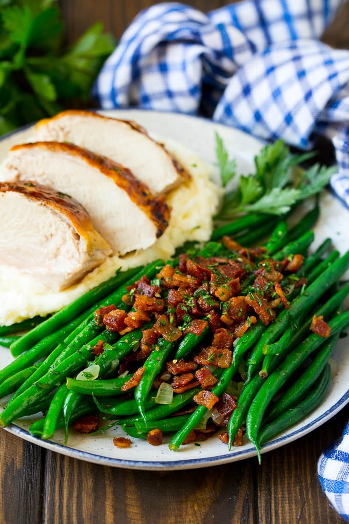 Green Beans with Bacon Recipe | Bacon Green Beans #bacon #greenbeans #sidedish #thanksgiving #veggies #dinner #jonep Green beans with bacon served alongside turkey and mashed potatoes.