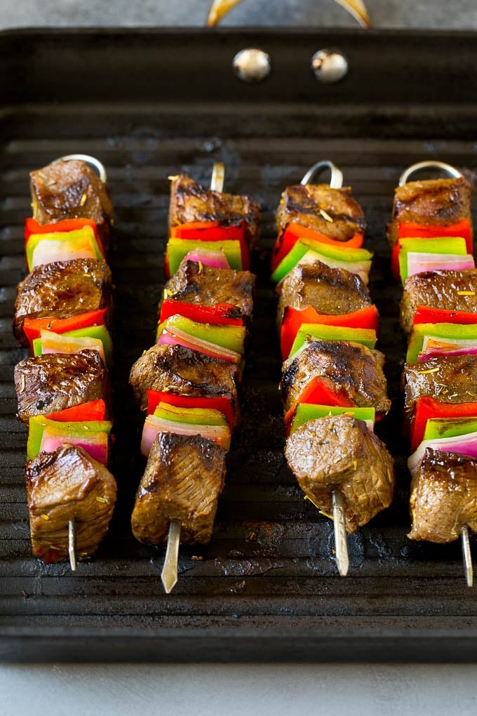 Beef Shish Kabobs Recipe | Beef Kabobs #grilling #beef #steak #dinner #jonep #peppers Beef skewers cooking on a grill pan.