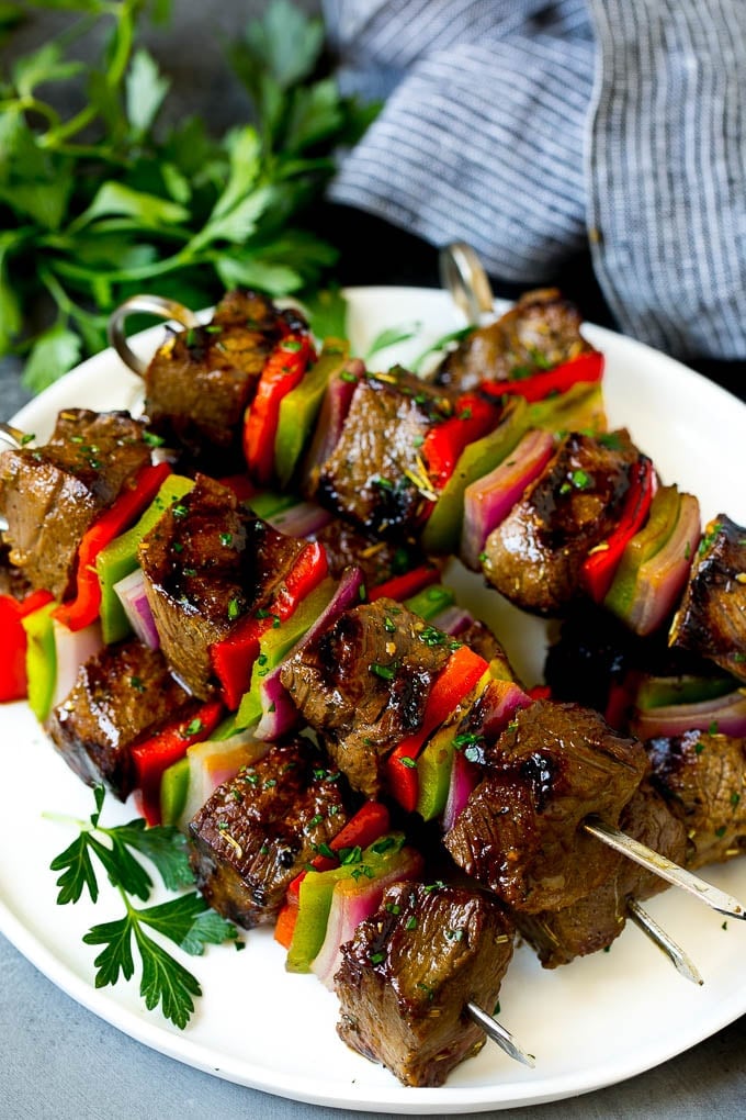 Beef Shish Kabobs Recipe | Beef Kabobs #grilling #beef #steak #dinner #jonep #peppers Shish kabob made with beef, peppers and onions on a serving plate.
