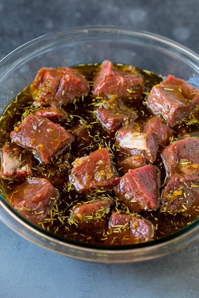 Beef Shish Kabobs Recipe | Beef Kabobs #grilling #beef #steak #dinner #jonep #peppers Steak cubes in a bowl of marinade.