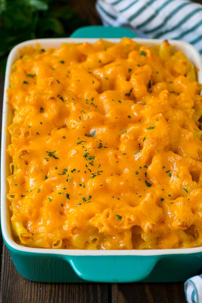 Southern Mac and Cheese | Baked Macaroni and Cheese #pasta #macandcheese #dinner #comfortfood #cheese #jonep Southern mac and cheese topped with melted cheddar and parsley.