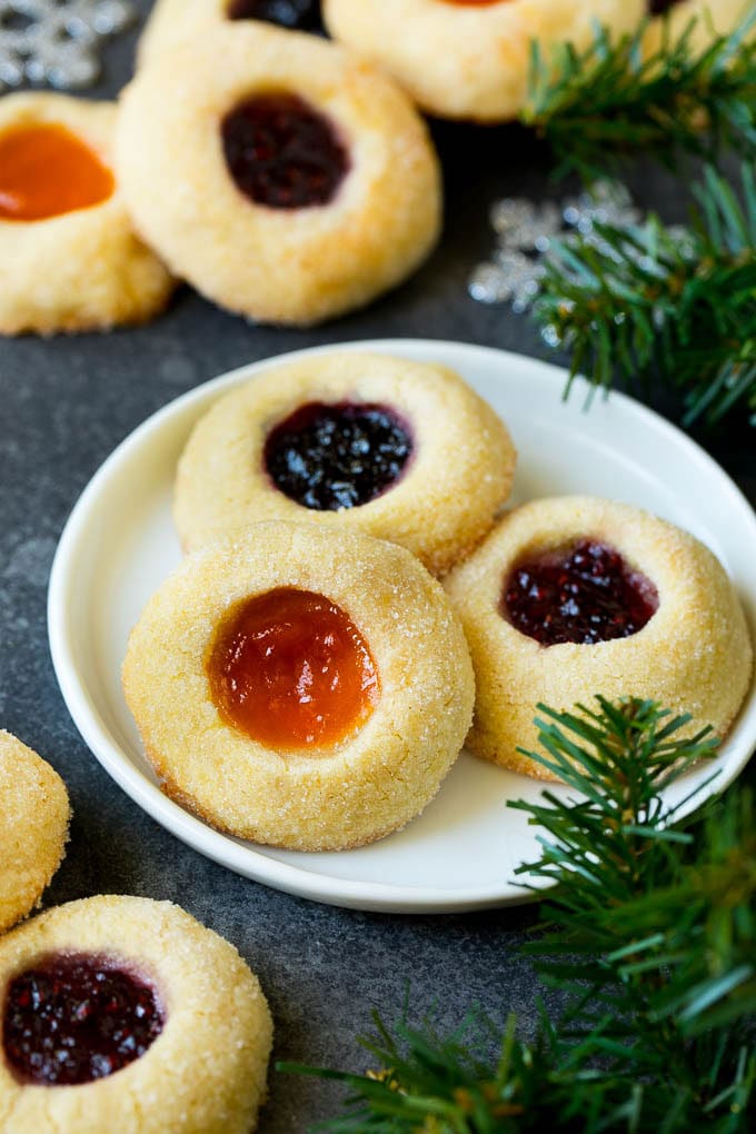 Thumbprint Cookies | Sugar Cookies #cookies #baking #christmas #dessert #jonep A plate of jam filled thumbprint cookies.