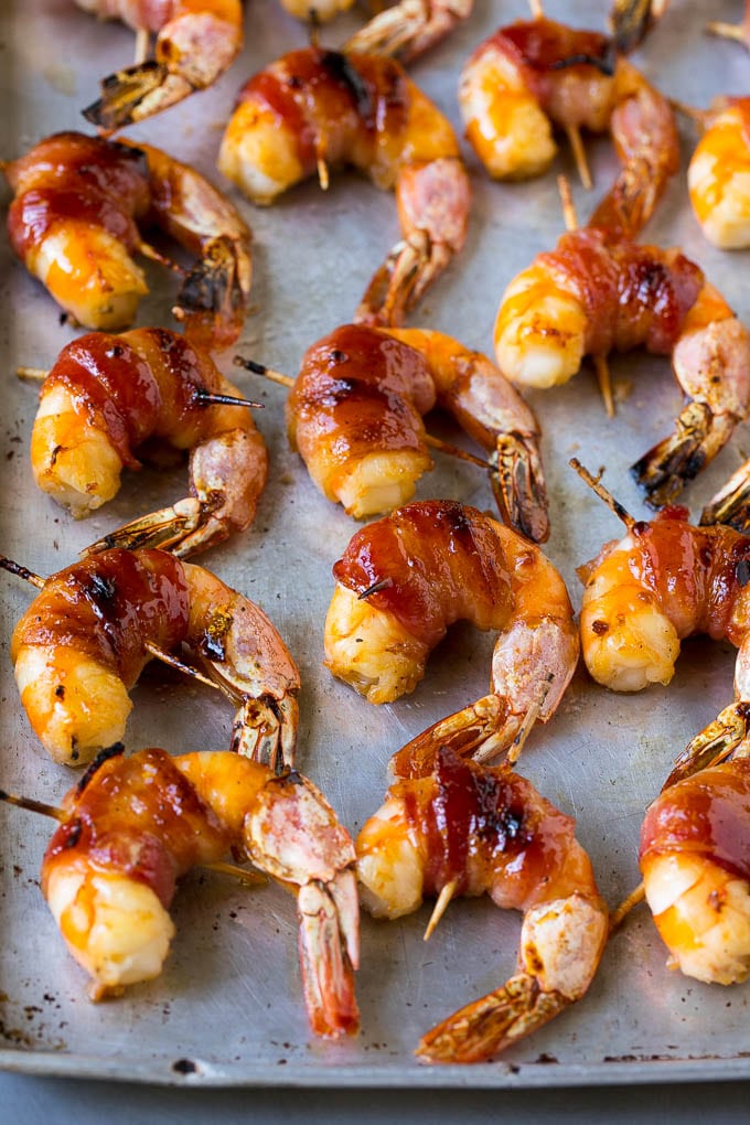 Bacon Wrapped Shrimp Recipe | Bacon Shrimp #shrimp #bacon #appetizer #dinner #jonep #seafood Roasted shrimp with a piece of bacon around each one.
