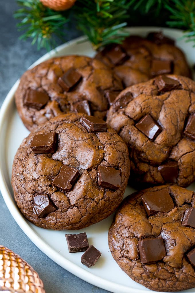 Brownie Cookies Recipe | Chocolate Cookies #cookies #brownies #chocolate #dessert #baking #jonep Brownie cookies on a serving plate, topped with chocolate chunks.