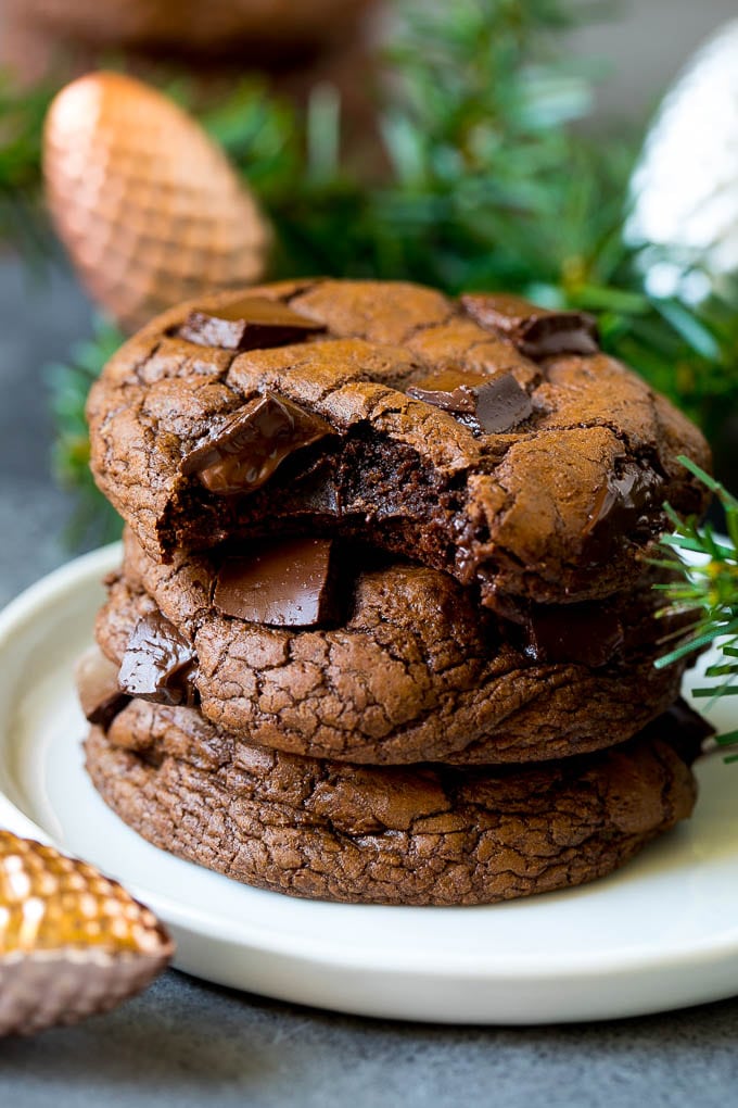 Brownie Cookies Recipe | Chocolate Cookies #cookies #brownies #chocolate #dessert #baking #jonep A stack of brownie cookies with a bite taken out of one.
