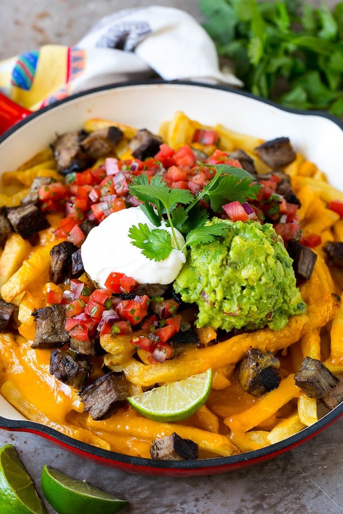 Carne Asada Fries Recipe | Steak Fries #fries #frenchfries #steak #salsa #avocado #cheese #dinner #appetizer #jonep Carne asada fries topped with melted cheese, steak, salsa and guacamole.