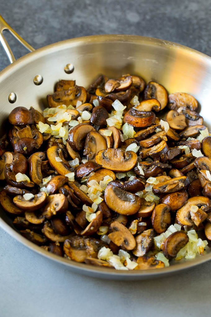 Chicken Stroganoff Recipe | Chicken and Mushrooms #chicken #mushrooms #stroganoff #dinner #jonep Sauteed mushrooms and onions in a skillet.