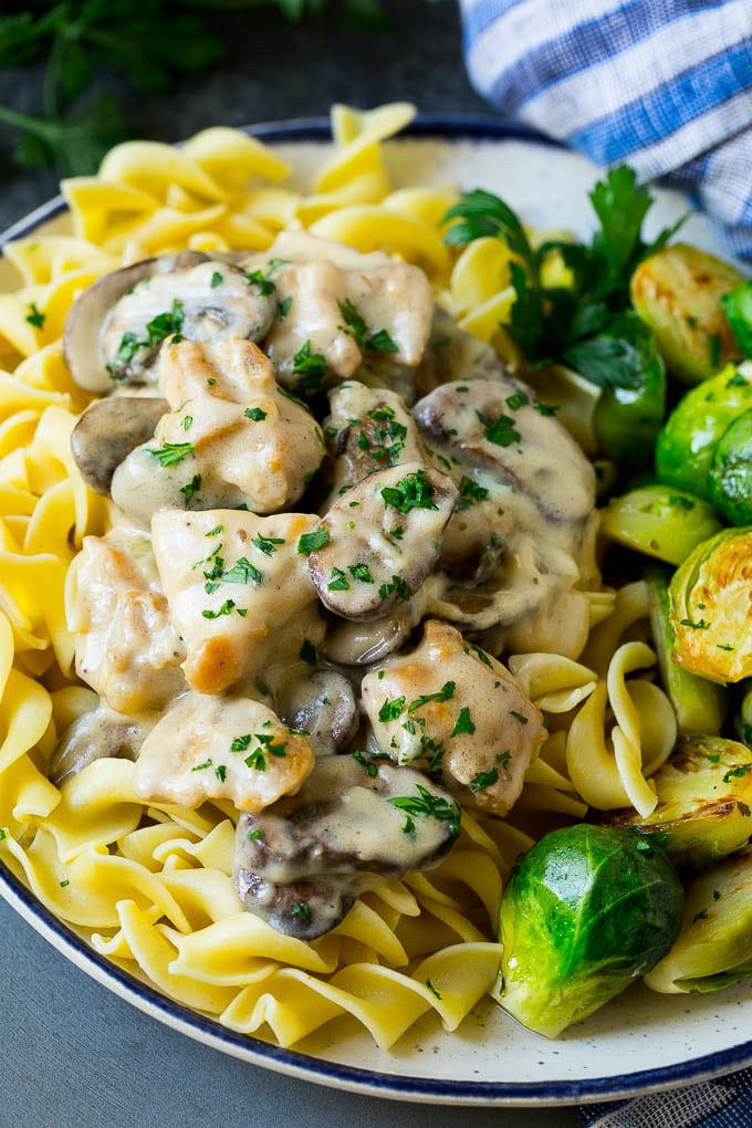 Chicken Stroganoff Recipe | Chicken and Mushrooms #chicken #mushrooms #stroganoff #dinner #jonep Chicken stroganoff over egg noodles with brussels sprouts on the side.