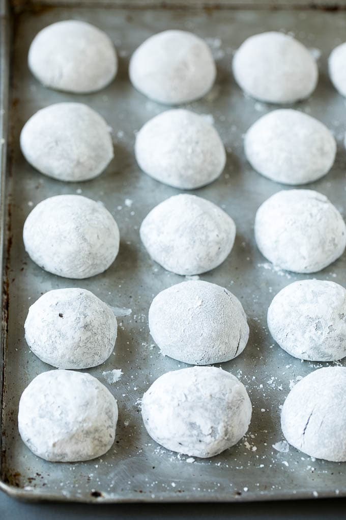 Chocolate Crinkle Cookies Recipe #cookies #chocolate #christmas #dessert #baking #jonep Balls of cookie dough rolled in powdered sugar.