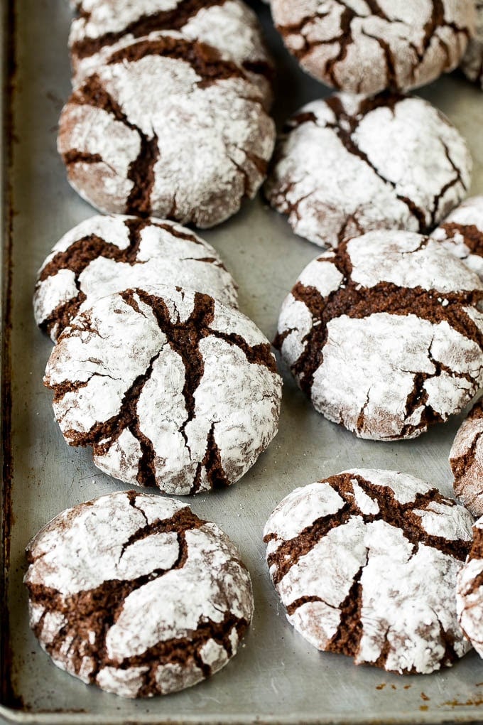 Chocolate Crinkle Cookies Recipe #cookies #chocolate #christmas #dessert #baking #jonep Crinkle cookies on a sheet pan.