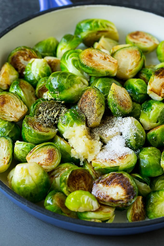Sauteed Brussels Sprouts Recipe | Brussels Sprouts Side Dish #brusselssprouts #sprouts #veggies #sidedish #garlic #vegetarian #dinner #jonep Sprouts in a pan seasoned with salt, pepper, garlic and dried herbs.