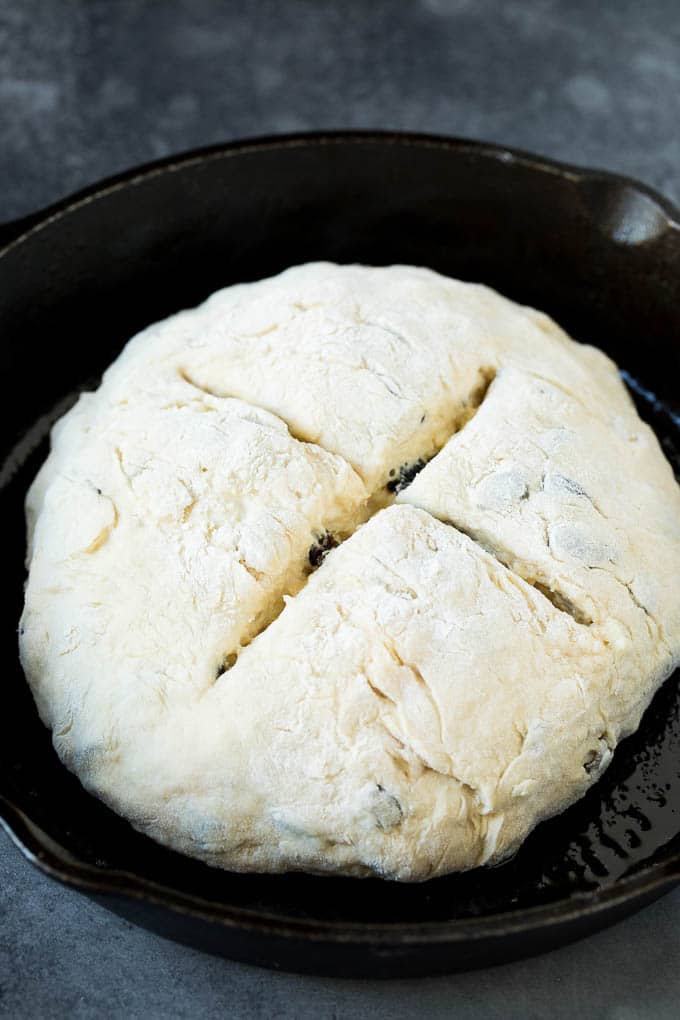 Irish Soda Bread Recipe #bread #baking #stpatricksday #sidedish #jonep A shaped loaf of soda bread in a skillet.