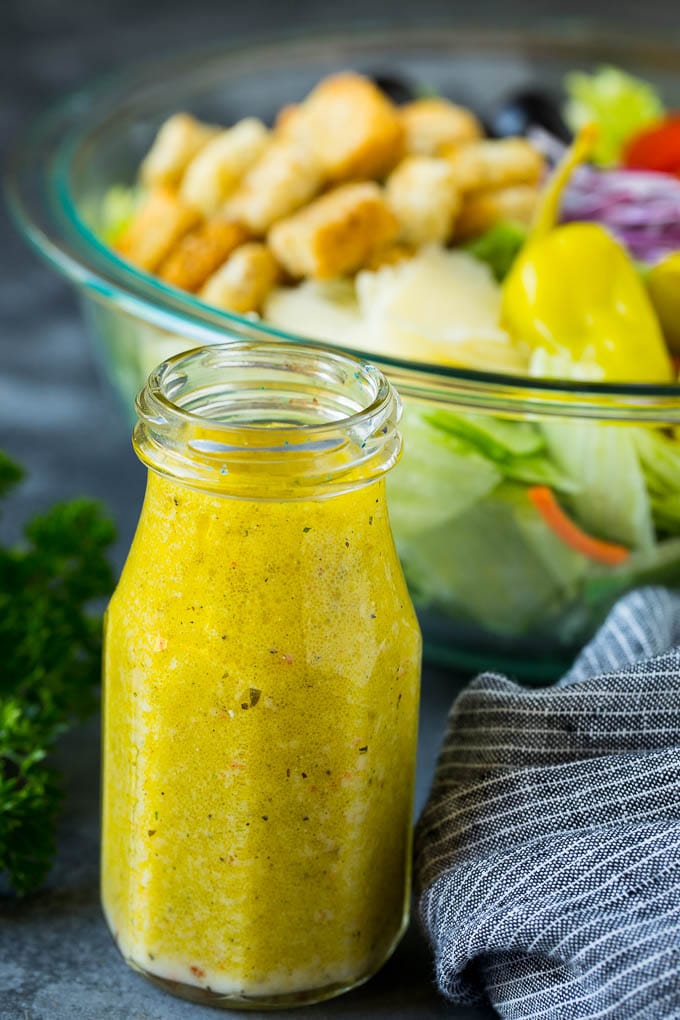 Olive Garden Salad Recipe | Italian Salad #salad #lettuce #olives #sidedish #dinner #jonep A bottle of homemade salad dressing.