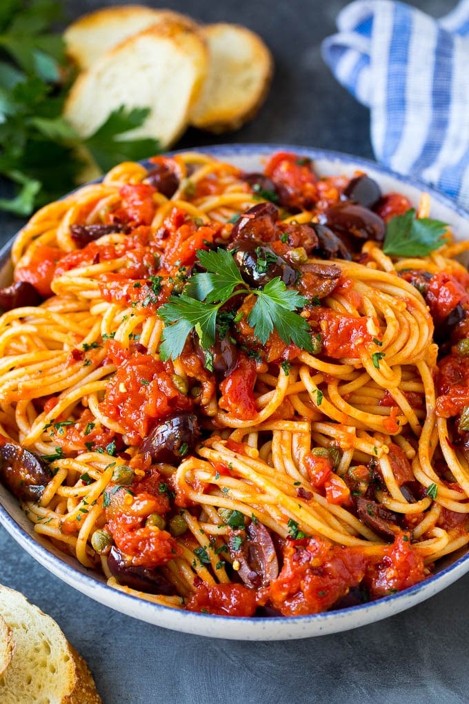Pasta Puttanesca Recipe #pasta #tomatoes #olives #italianfood #dinner #jonep Pasta puttanesca with spaghetti tossed in a homemade tomato sauce.