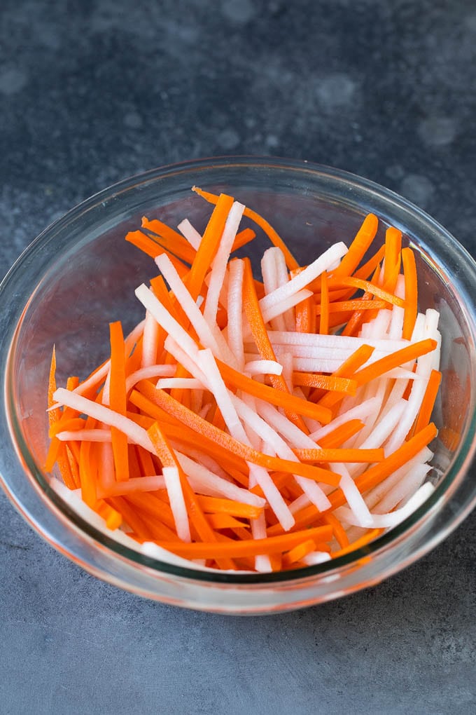 Bahn Mi Sandwich Recipe #sandwich #pork #lunch #dinner #jonep Shredded carrots and daikon radish in a bowl.
