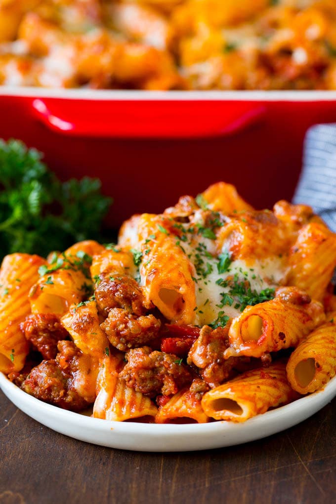 Baked Rigatoni Pasta #pasta #dinner #italianfood #groundbeef #jonep #casserole A plate of baked rigatoni topped with melted cheese.