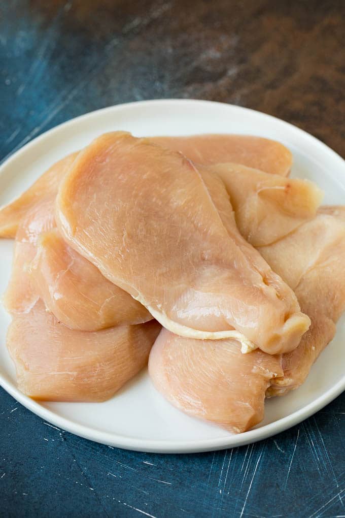 Chicken Francese Recipe #chicken #lemon #dinner #jonep Thin cut chicken breasts on a plate.