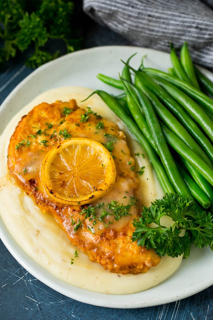Chicken Francese Recipe #chicken #lemon #dinner #jonep Chicken francese served over mashed potatoes with green beans.