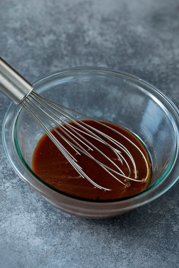 Asian Slaw Recipe #salad #slaw #sidedish #jonep A bowl of homemade sesame ginger dressing.