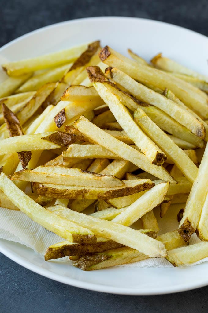 Homemade French Fries Recipe #potatoes #fries #dinner #jonep Par-fried potatoes on a plate.