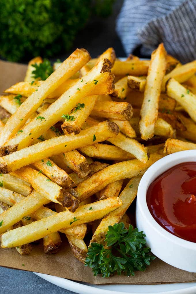 Homemade French Fries Recipe #potatoes #fries #dinner #jonep A plate of homemade french fries served with a bowl of ketchup.