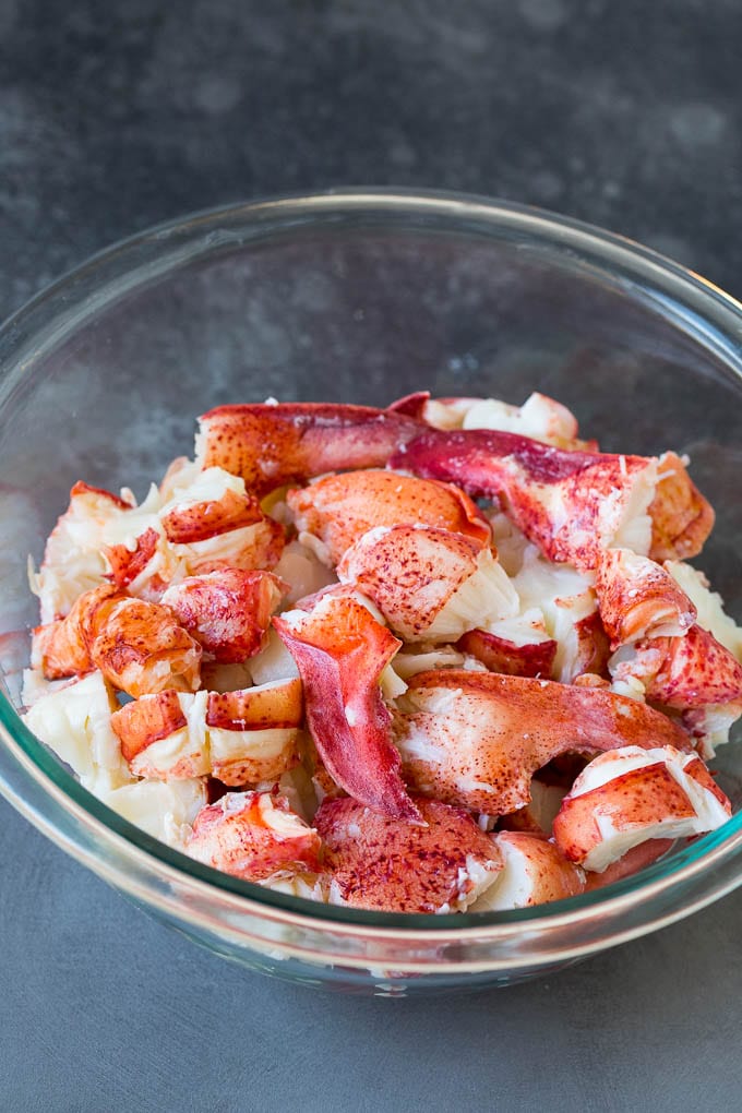 Lobster rolls stuffed with creamy lobster salad in a toasted bun. #lobster #jonep Chunks of lobster meat in a bowl.