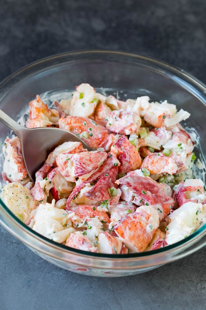 Lobster rolls stuffed with creamy lobster salad in a toasted bun. #lobster #jonep Lobster salad in a bowl in a creamy dressing.