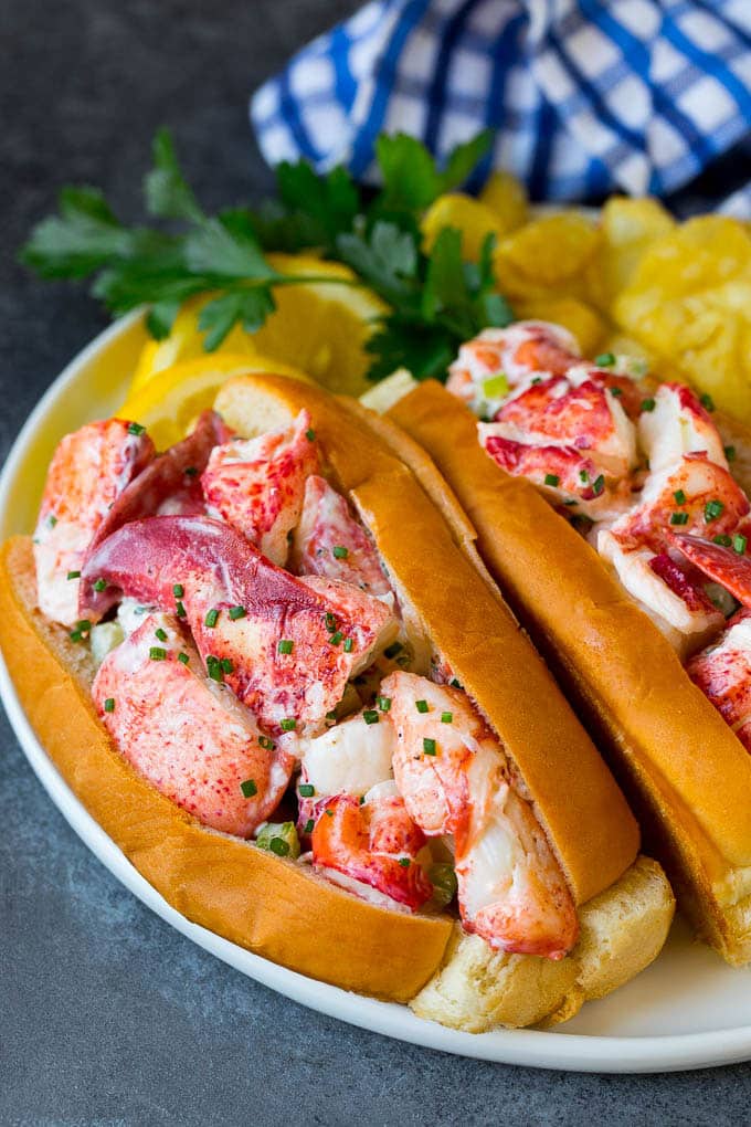 Lobster rolls stuffed with creamy lobster salad in a toasted bun. #lobster #jonep Lobster roll with chunks of fresh lobster meat in a buttered and toasted bun.