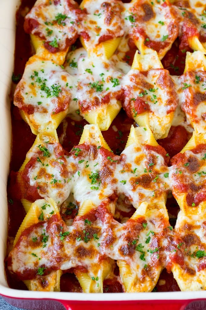 Baked stuffed shells filled with three types of cheese and topped with marinara sauce. #pasta #jonep Baked stuffed shells filled with three types of cheese and topped with marinara sauce.