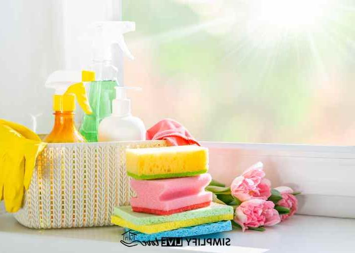use a portable cleaning caddy to clean rooms faster; white basket wtih gloves, cleaning sprays, and microfiber cloths