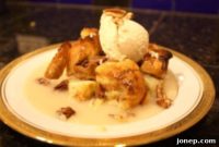 Warm Apple Bread Pudding with Cinnamon Ice Cream and Bourbon Cream Sauce