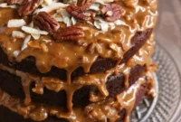 Cola-Infused Chocolate Cake with Dulce de Leche Toasted Coconut and Pecan Crunch Frosting