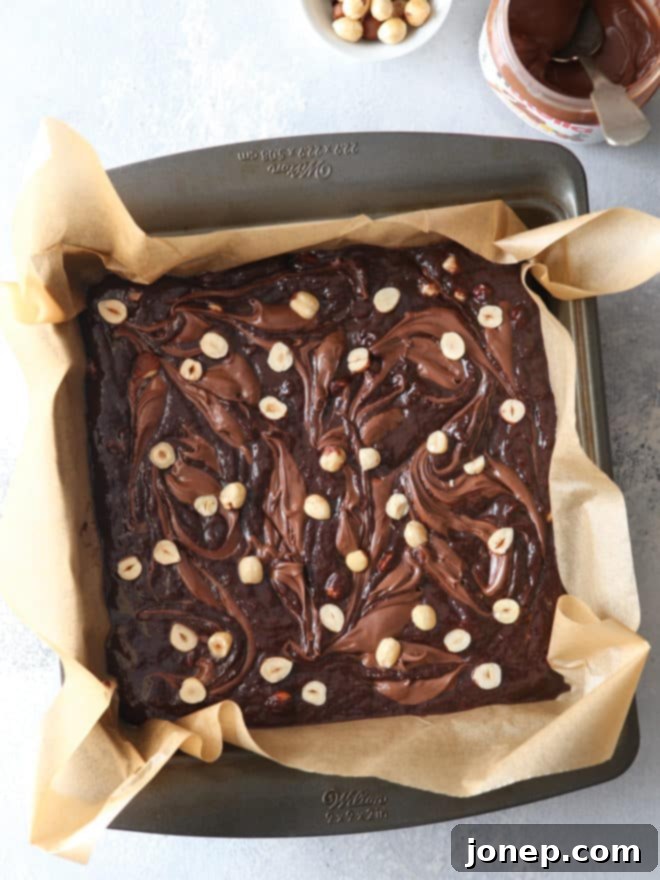 Nutella brownies with hazelnuts, shot from above showing the swirl pattern
