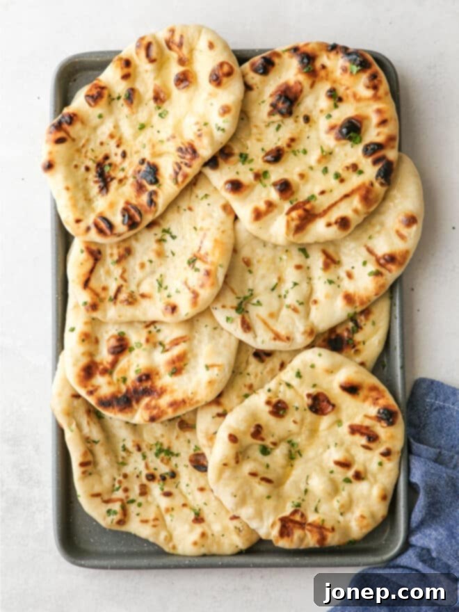Fire-Kissed Flatbread 8 grilled flatbread on a baking sheet pan